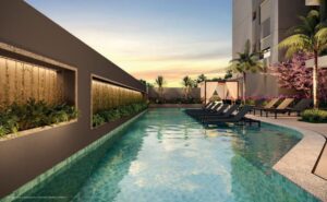 Imagem ilustrativa das piscinas infantil e adulto com deck molhado onde cabem bem mais de 6 cadeiras, deck seco, pool house e paisagismo no entorno
